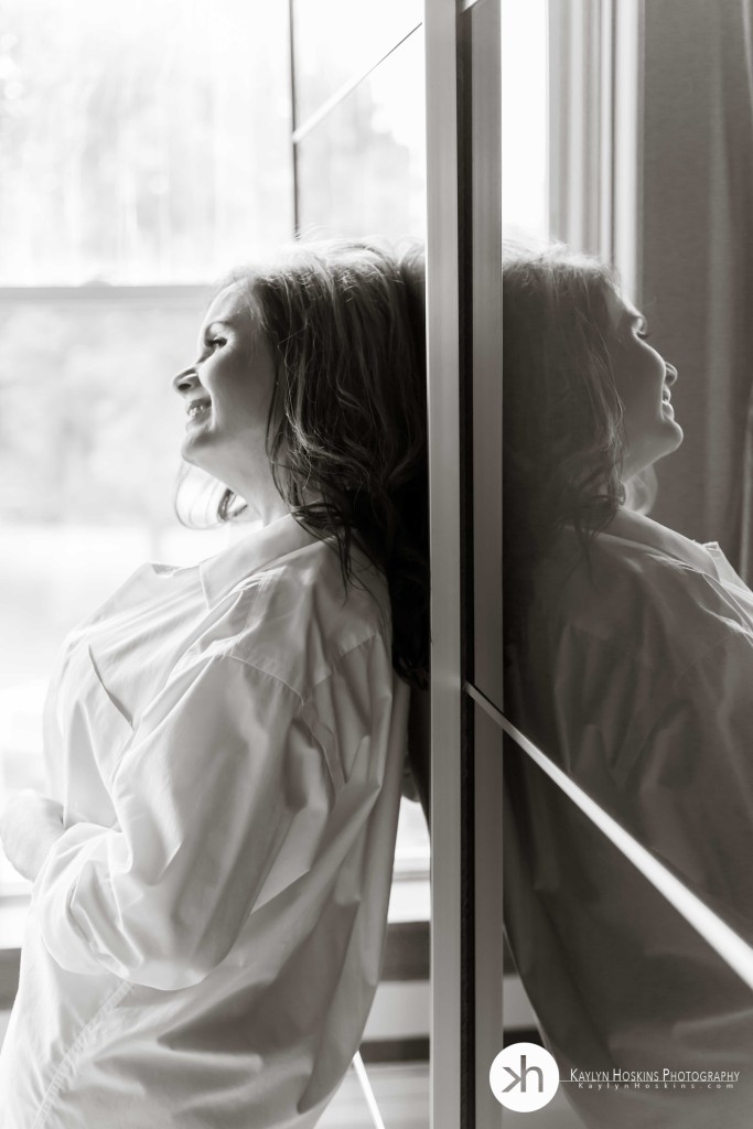 Boudoir client laughing while reflected in ikea closet