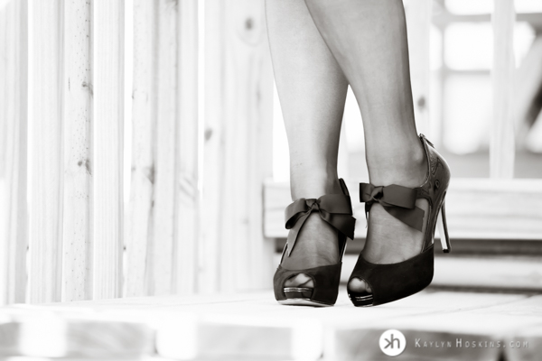 Boudoir Goddess wears adorable heals on deck during boudoir experience 