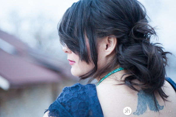 Boudoir Goddess looking over her shoulder during boudoir experience in Solon, Iowa