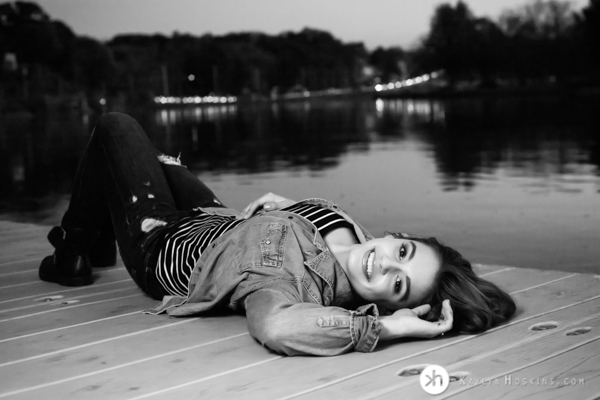 Solon Senior Junior Rower lays on dock at P. Sue Beckwith, M. D. Boathouse