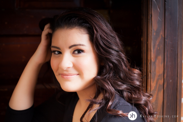 HS Senior Delaney plays with her hair during senior portraits