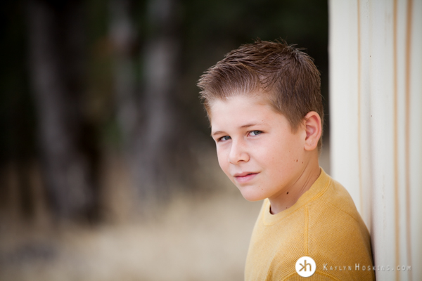 Gabe leaning up against wall in portraits