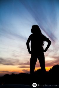 Sunset Silhouette of Senior Gracen during her Senior Photos at Kaylyn Hoskins Photography in Solon, Iowa