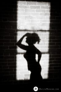 Boudoir Goddess Silhouetted in shadow from large window