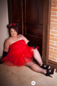 Gorgeous Goddess in red tutu, Minnie Mouse ears & fishnets sitting in doorway