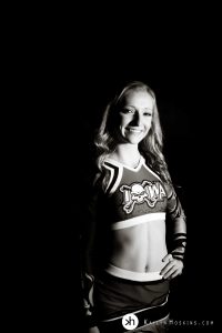 Solon Senior wearing her Iowa Elite Cheer uniform during senior photo shoot