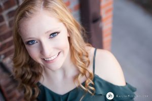 Solon Senior Olivia smiles at camera during photo shoot with Kaylyn Hoskins Photography