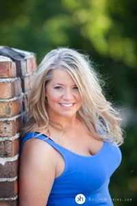 Gorgeous Boudoir Goddess leaning up against old chimney on rooftop during boudoir experience