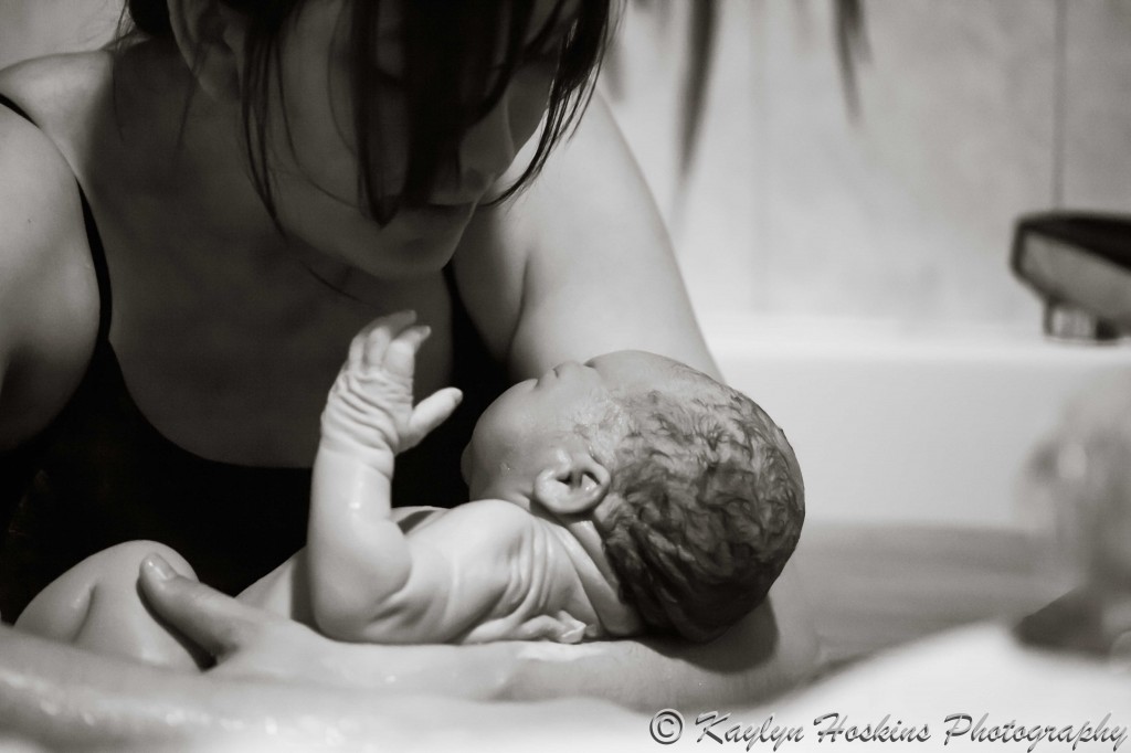A moment of adoration between Home birth Mom and newborn boy