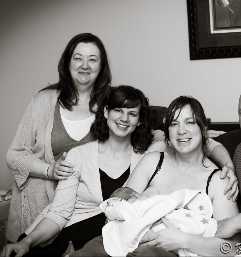 Midwives with Mother and newborn water birthed boy