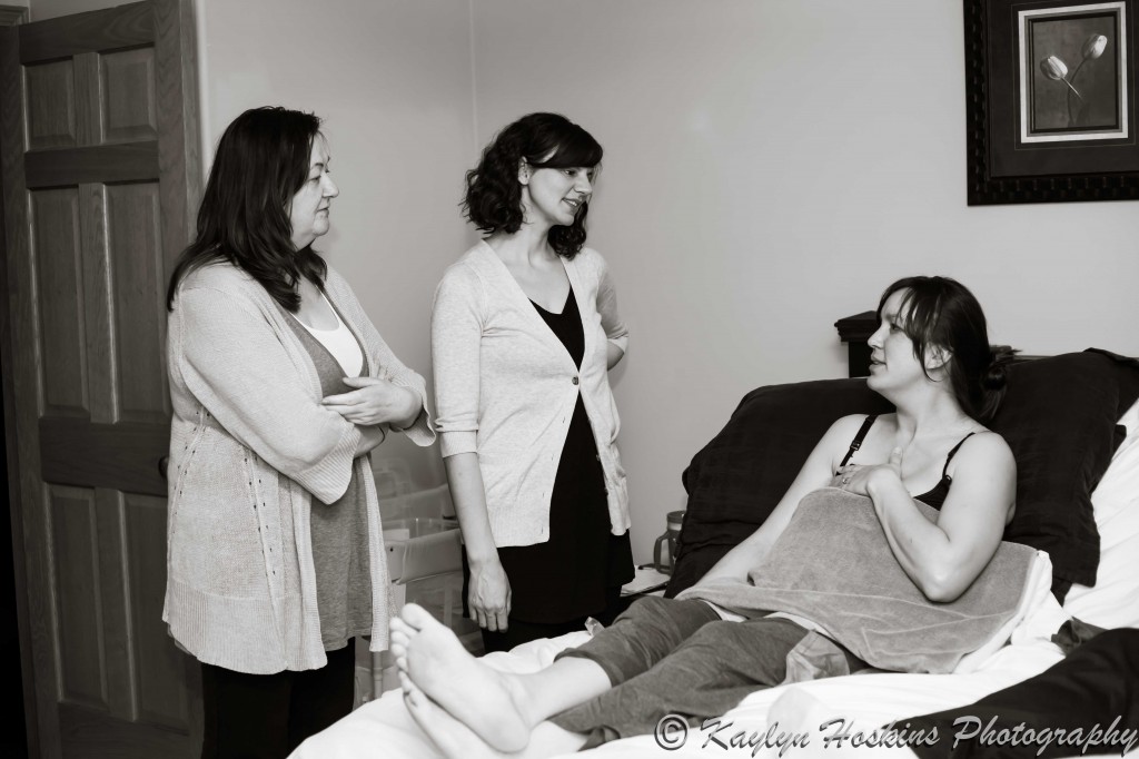 midwives talk to new home birth Mother before they leave for the night