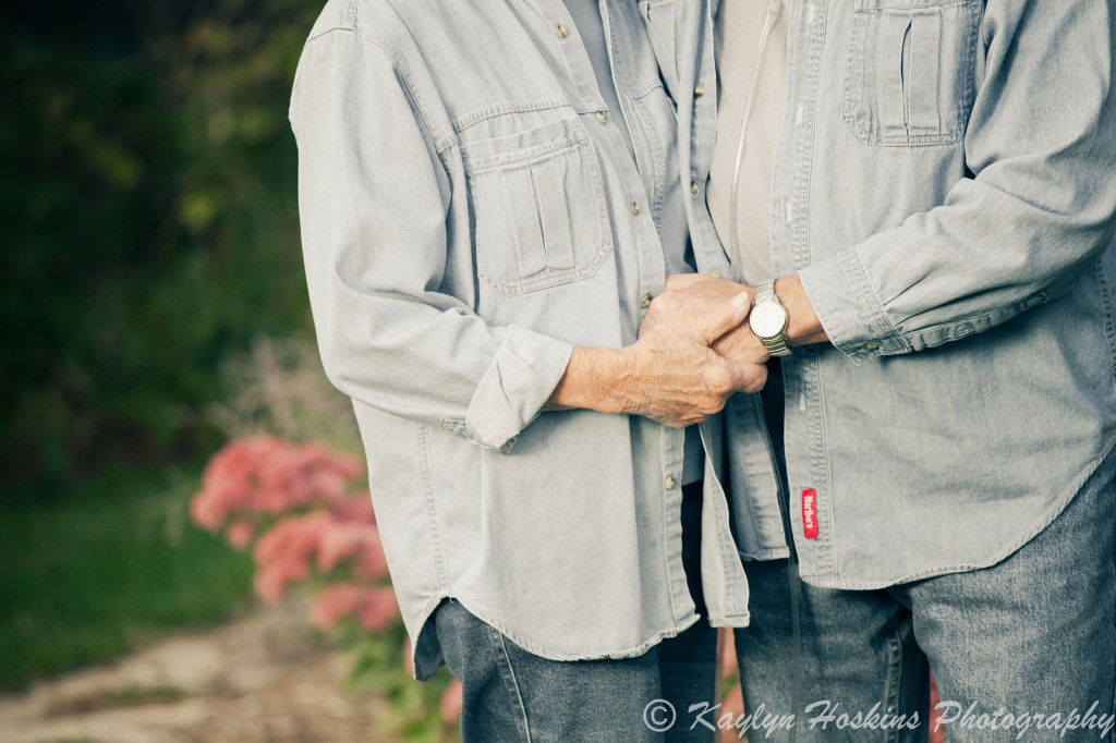 Gramz and Grampz holding hands in matching outfits during their photography session