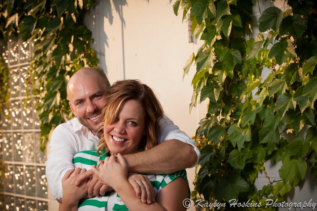 engagement couple smile at camera during photo shoot in New Bo area Cedar Rapids, Iowa