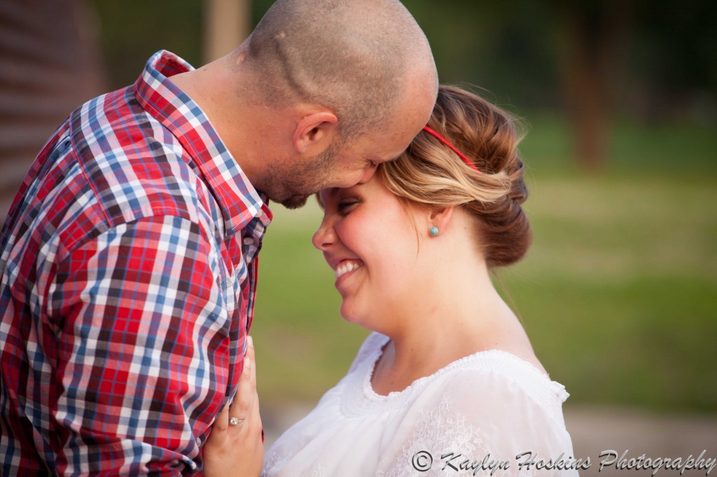 bride to be being adored by her fiance