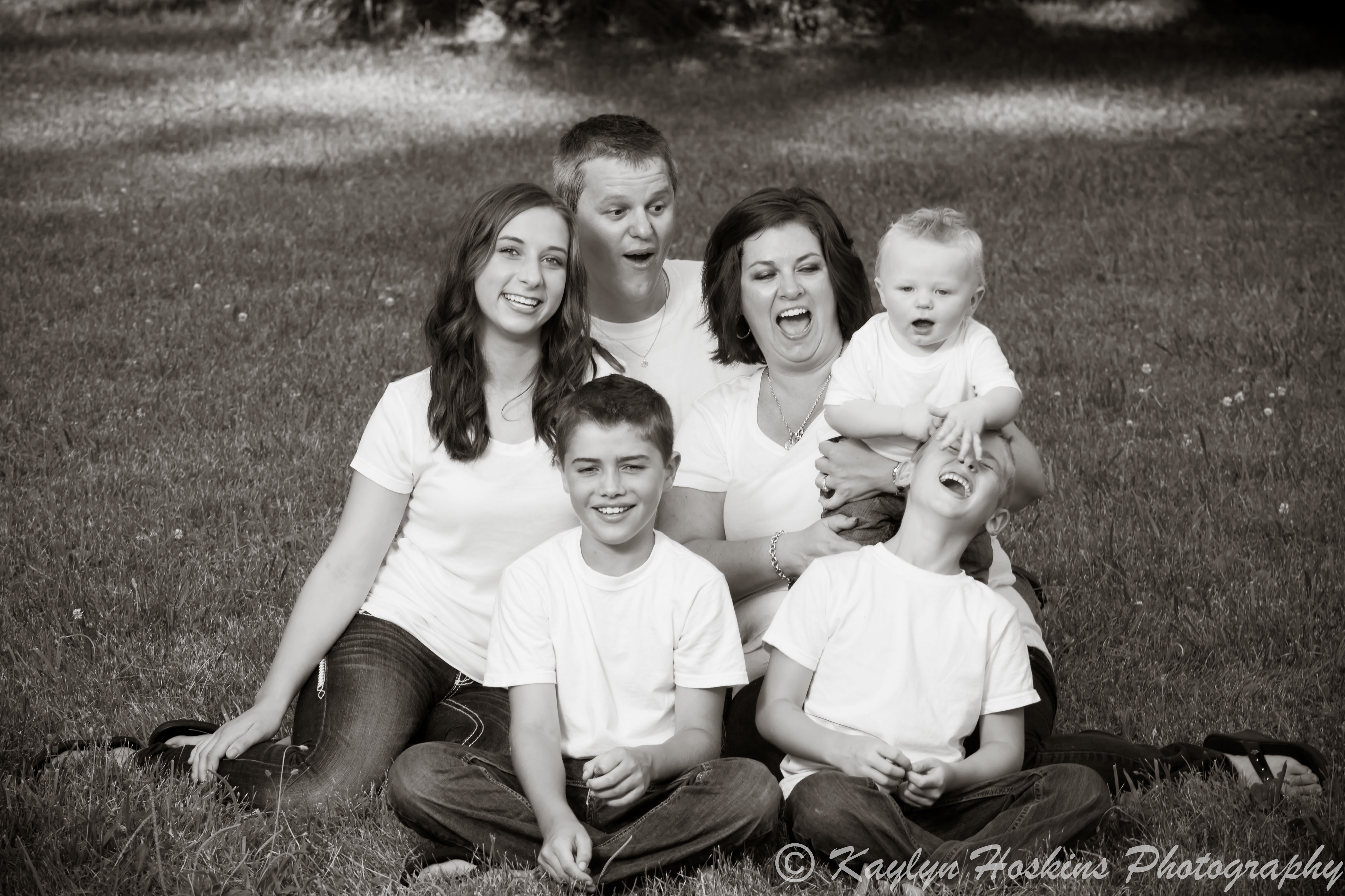 Young son pulls older brother's hair during family pictures with Kaylyn Hoskins Photography