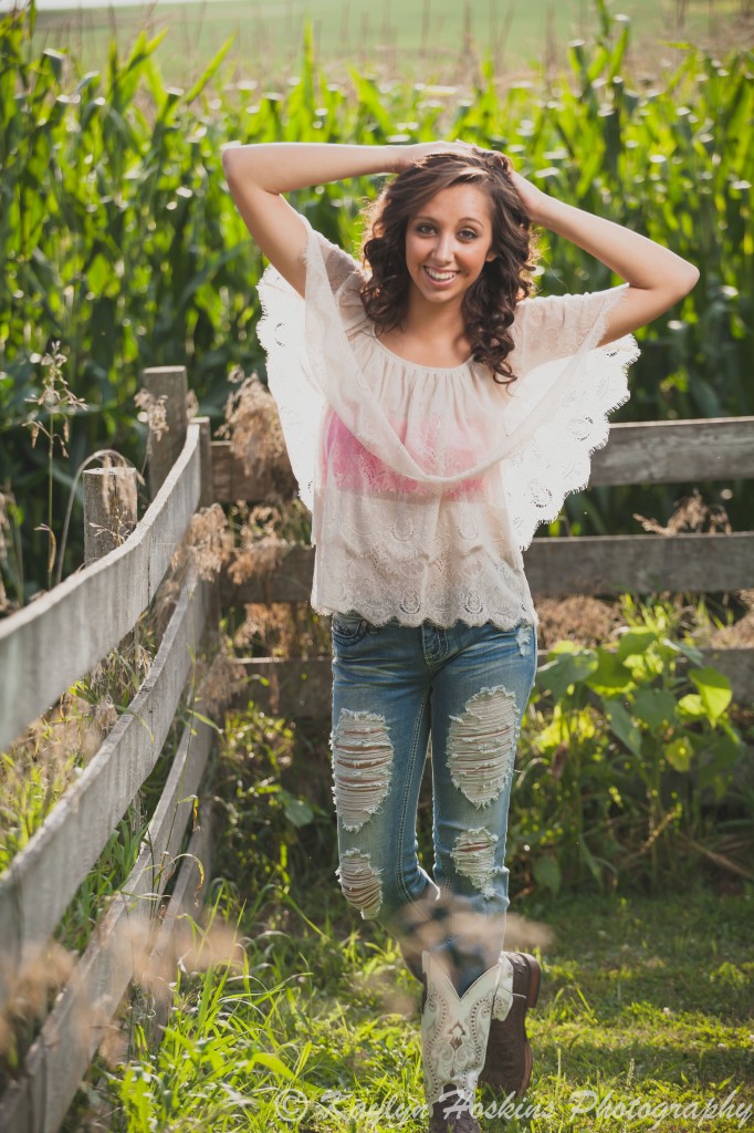 Solon senior poses by corn field in West Liberty during her shoot with Kaylyn Hoskins Photography