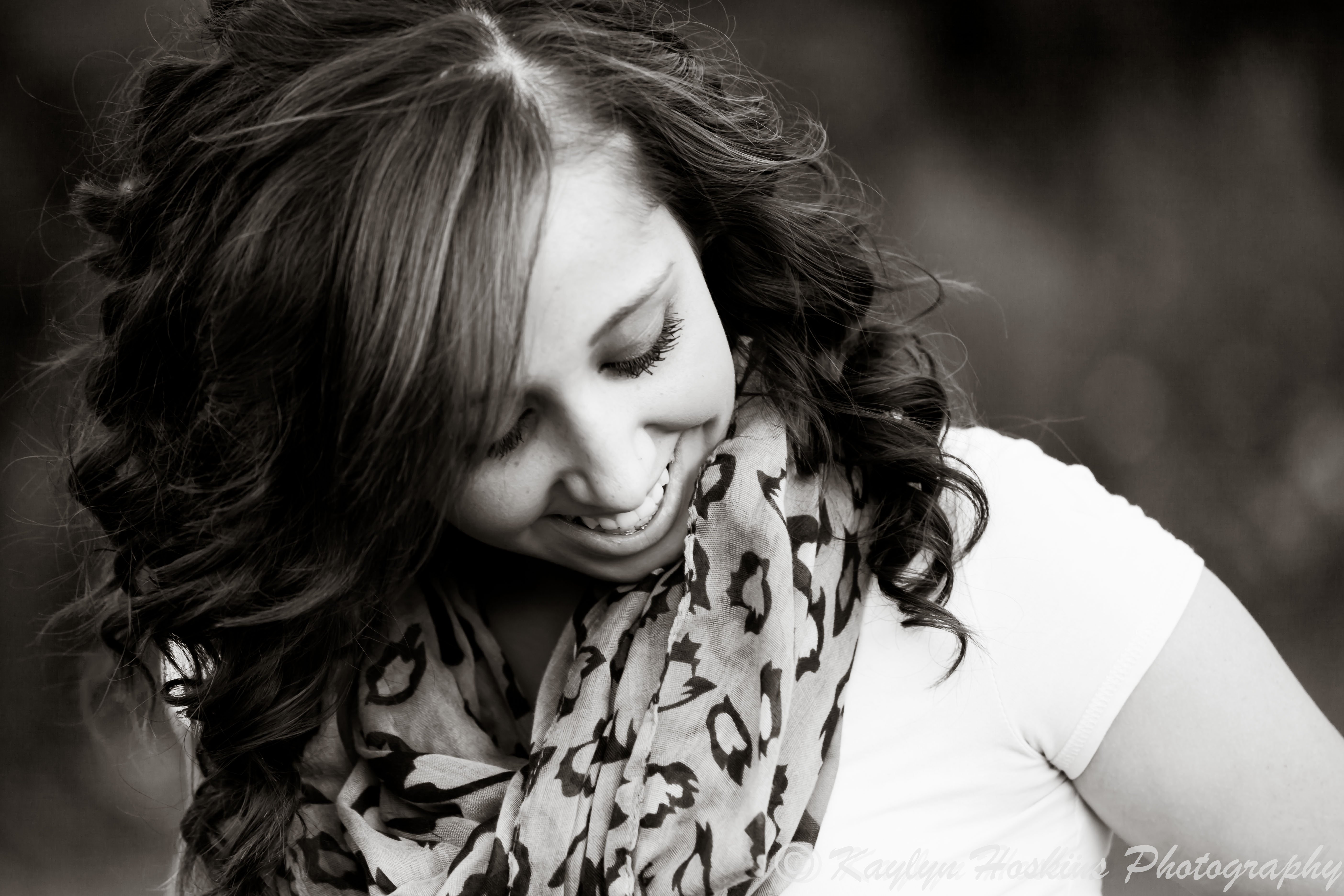 Beautiful Senior laughs during senior pics session with kaylyn hoskins photography