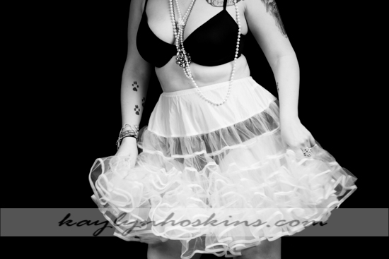 Ms. F dances around in her fluffy skirt during her boudoir experience with Kaylyn Hoskins Photography