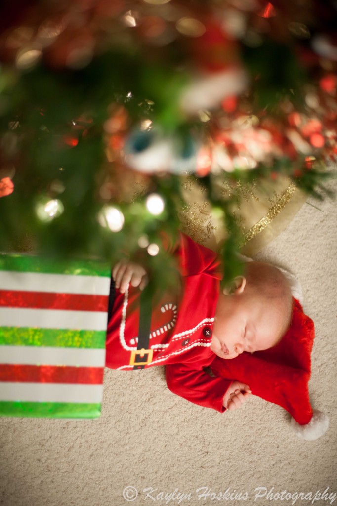 baby is a gift under the christmas tree