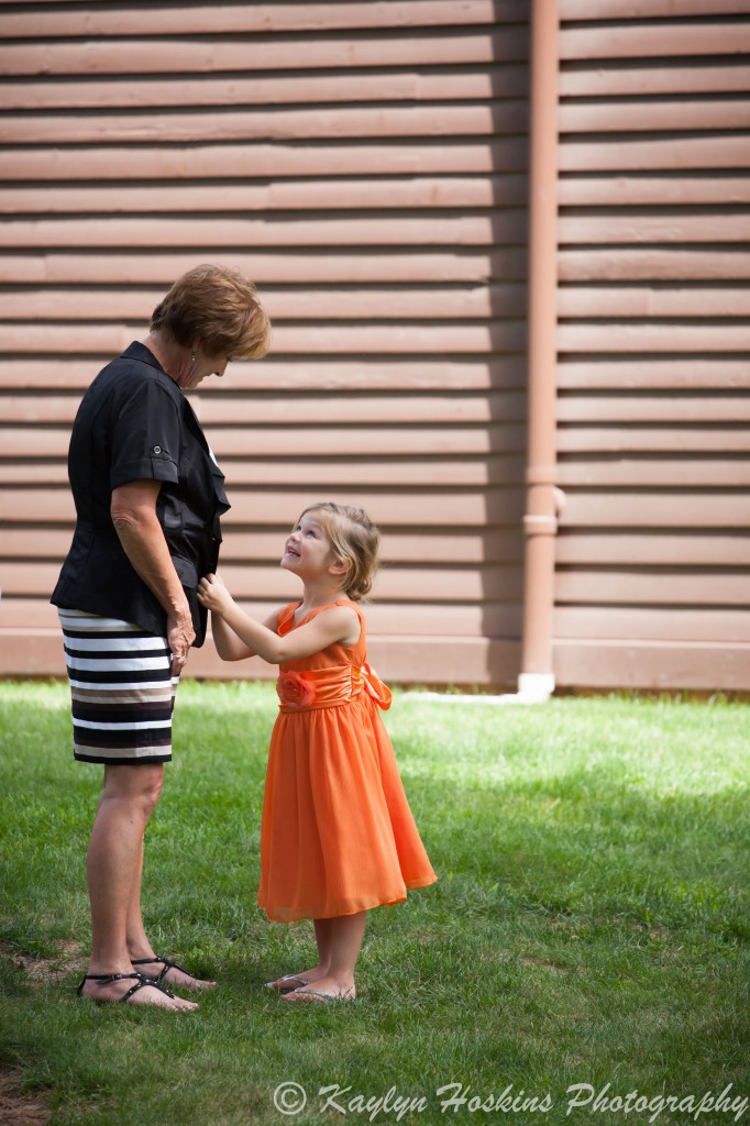 Grandmother and granddaughter share a sweet moment before the ceremony at the Little Brown Church in Nashua, IA