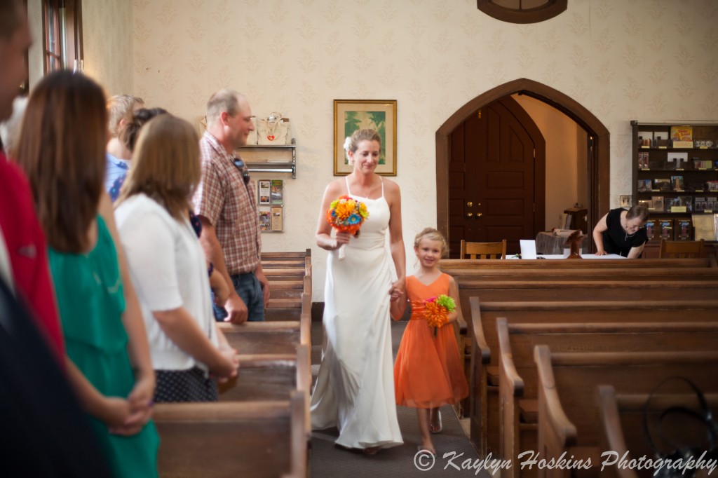 Bride's oldest daughter walks her down the isle to get married at the Little Brown Church in Nashua