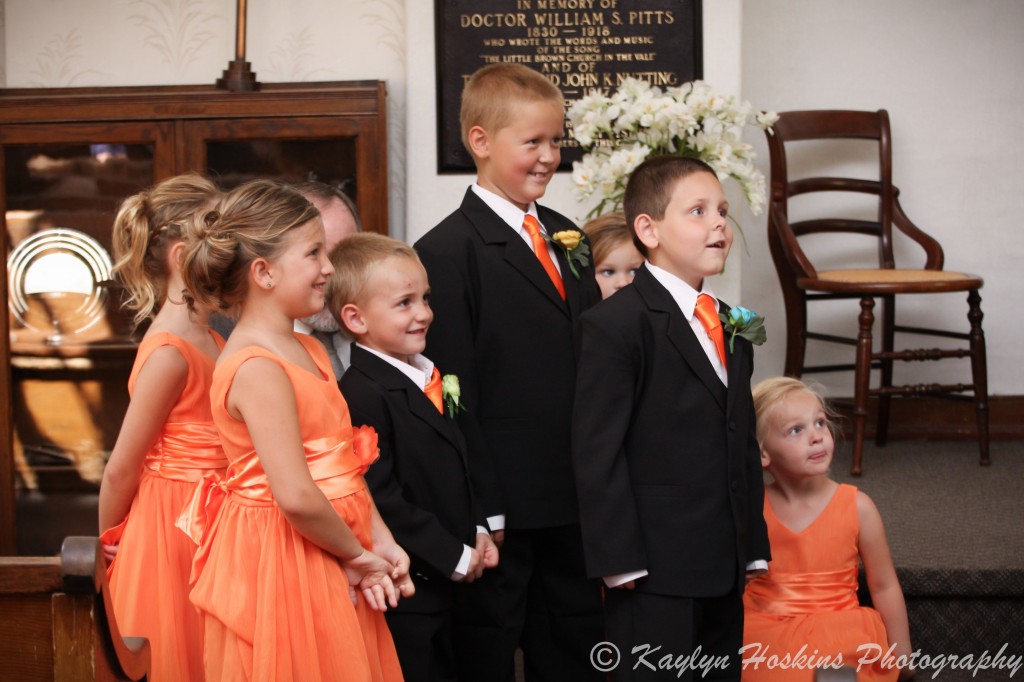 The kids tell the groom he can kiss his bride at Little Brown Church in Nashua