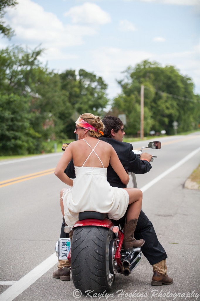 Bride and groom ready to ride off on harley to reception at the Little Brown Church in Nashua