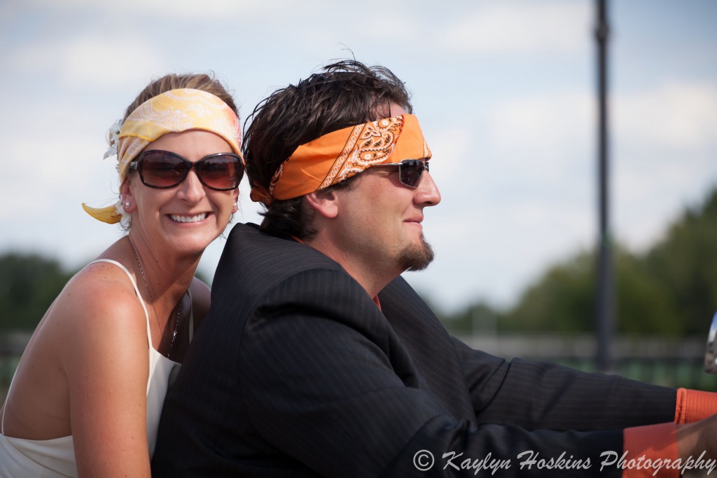 Bride and Groom cross a bridge before heading to their wedding reception in Iowa