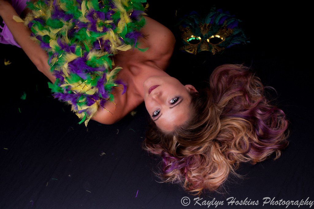 Gorgeous Woman laying down covered only by feather boa