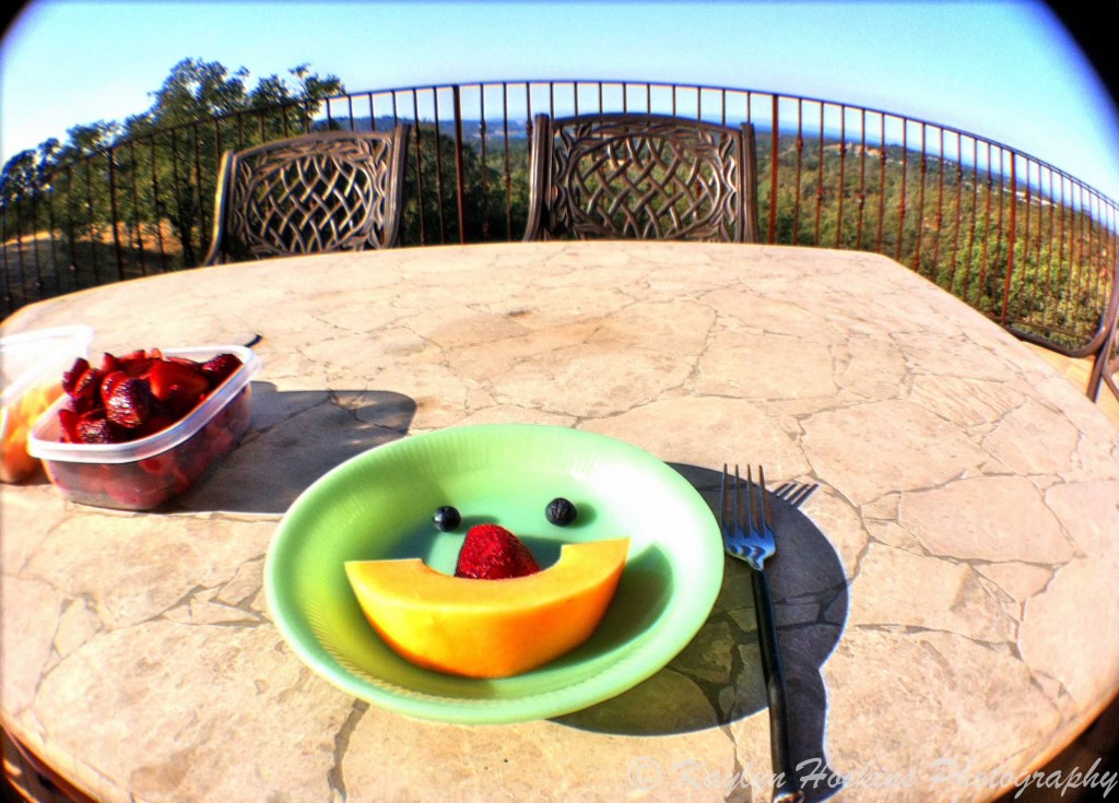 fun face in fruit bowl sitting on beautiful deck in California