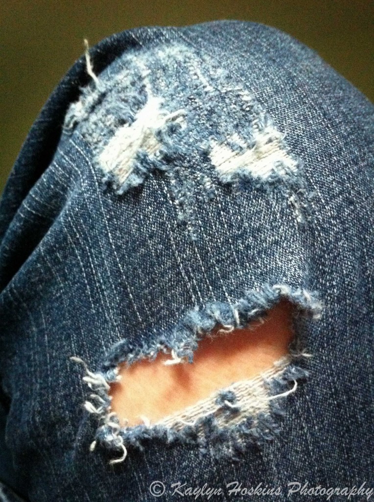 funny face in torn jeans